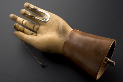 This prosthetic hand was designed by Thomas Openshaw around 1916 while working as a surgeon for Queen Mary's Hospital. Two fingers of the wooden hand are reinforced with metal hooks to help with daily tasks.